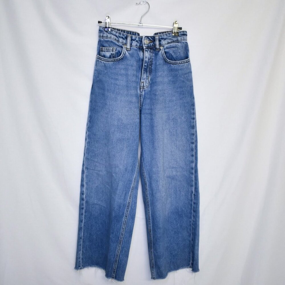 High-waisted mid-wash denim jeans